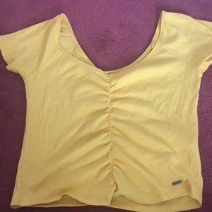 A cute, yellow shirt. Never worn before